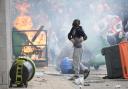 Far-right protesters are seen during riots outside of the Holiday Inn Express in Manvers, which is being used as an asylum hotel,  in Rotherham