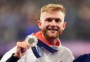 Josh Kerr with his silver medal following the Men's 1500m Final at the Stade de France