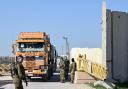 Trucks carrying humanitarian aid at the Kerem Shalom border crossing with the southern Gaza Strip