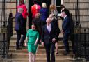 SNP First Minister John Swinney (front right) and Deputy First Minister Kate Forbes walk to speak to media as the rest of the Cabinet heads in Bute House