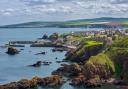 The fishing village of St Abbs seen from the southern side of St Abb's Head, Berwickshire, Scotland