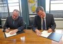 Alex Salmond and David Cameron sign a referendum agreement at St Andrew's House in Edinburgh on October 15, 2012 in Edinburgh