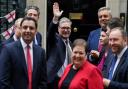 Keir Starmer waves as Scottish Labour MPs and MSPs attend a photocall outside Downing Street