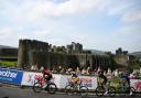 The Tour of Britain will start in Kelso on Tuesday. Shown: the race passing Caerphilly Castle in Wales