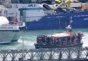 A group of people thought to be migrants are brought in to Dover, Kent, onboard the RNLI Dungeness Lifeboat following a small boat incident