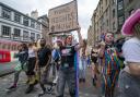 People take part in the Pride Edinburgh 2024 parade through Edinburgh city centre.