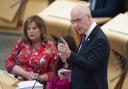 The First Minister John Swinney in the Scottish Parliament