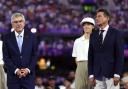 Thomas Bach, left, and Sebastian Coe keep their distance at the closing ceremony of the Olympics in Paris