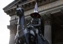 The Duke of Wellington statue with a traffic cone on its head outside Goma, Glasgow City centre.  Photograph by Colin Mearns