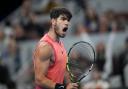 Carlos Alcaraz roars during his win over Jannik Sinner (Achmad Ibrahim/AP)