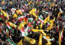 TEHRAN, IRAN - OCTOBER 02: People gather in Imam Hossein Square to support their country's missile strikes against Israel and to commemorate Hezbollah leader Hassan Nasrallah, who was killed in an Israeli airstrike on Beirut, Iranian Brigadier