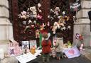 Parents and children lay out cuddly toys across the entrance to the Foreign Office in London, as they protest to save children's lives in Gaza