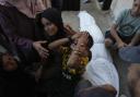 Mourners attend the funeral of Palestinians killed in an Israeli bombardment in Gaza