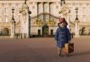 A still from Paddington 2 shows the bear outside Buckingham Palace