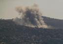 Smoke rises from an Israeli airstrike on Mansouri village, as it seen from the southern city of Tyre, south Lebanon