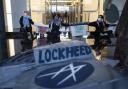 Police remove pro-Palestine activists after they shut down Lockheed Martin's headquarters entrance to demand an end to their weapons supply to Israel