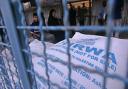 A Palestinian woman waiting for aid hand outs from UNRWA in 2014