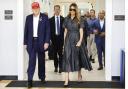 Donald Trump and Melania Trump walk after voting on US election day