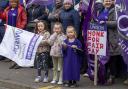 Striking school support workers take part in a demonstration outside First Minister John Swinney's constituency office in Blairgowrie