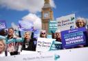 Campaigners in support of voluntary euthanasia protest outside Parliament in Westminster, London