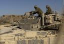 An Israeli soldier patrols near the border with the Gaza Strip