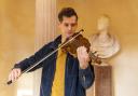 Ewen Henderson inside the Burns Monument playing the Gregg fiddle