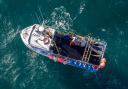 A fisherman landing his catch