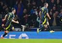 Scotland’s John McGinn (right) celebrates his winner (Jane Barlow/PA)