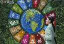 A person walks past art in the Turkey Pavilion at COP29