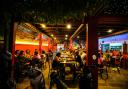 Foreign tourists have a drink at a night club at Nana Backpack hostel in Vang Vieng, Laos (Anupam Nath/AP)