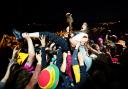 A guitarist from Idles in the crowd while playing during Glastonbury Festival this summer