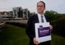 Sustainable Growth Commission chair Andrew Wilson pictured outside the Scottish Parliament