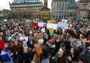 Young people pictured in George Square, Glasgow where they were protesting to raise awareness of climate change in 2019. Photograph: Colin Mearns
