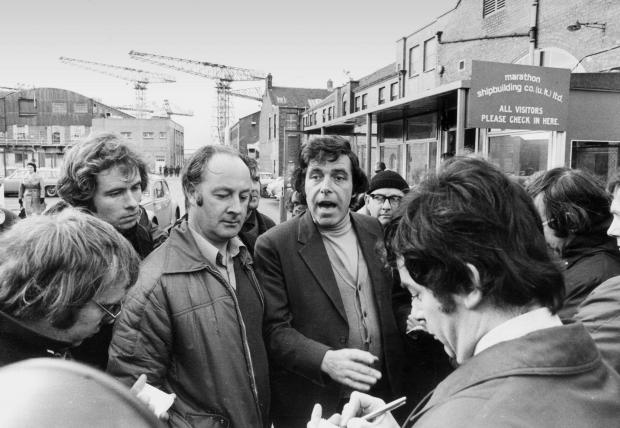 The National: The Upper Clyde Shipyard shop stewards, Jimmy Reid and Bob Dickie, speaking to reporters at the shipyard in Glasgow, 1971.