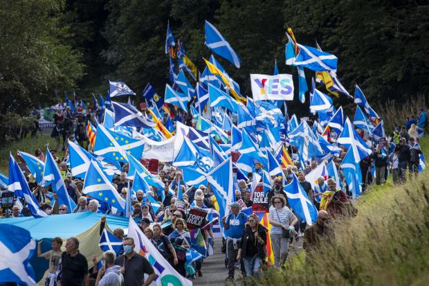 The National: 25/09/2021 Picture Duncan McGlynn +447771370263. Around 5,000 people from Independence group All Under One Banner marched though Holyrood Park in Edinburgh, Scotland towards the Scottish Parliament to protest for Scottish Independence. 