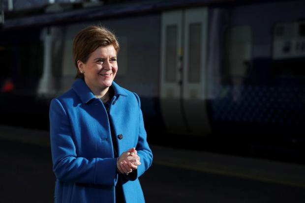 The National: First Minister Nicola Sturgeon gestures as she speaks at the relaunch of Glasgow Queen Street station in Glasgow. Picture date: Monday October 4, 2021. PA Photo. Photo credit should read: Russell Cheyne/PA Wire.