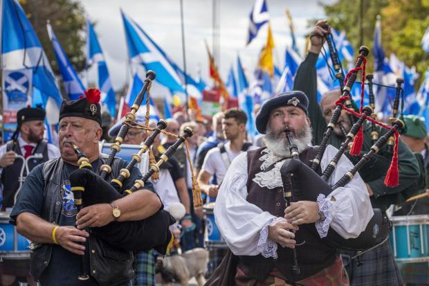 The National: Pipers at an AUOB-organised march through Edinburgh in September