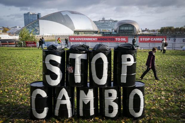 The National: Activists from Friends of the Earth during a demonstration calling for an end to all new oil and gas projects in the North Sea, starting with the proposed Cambo oil field, outside the UK Government's Cop26 hub during the Cop26 summit in Glasgow.