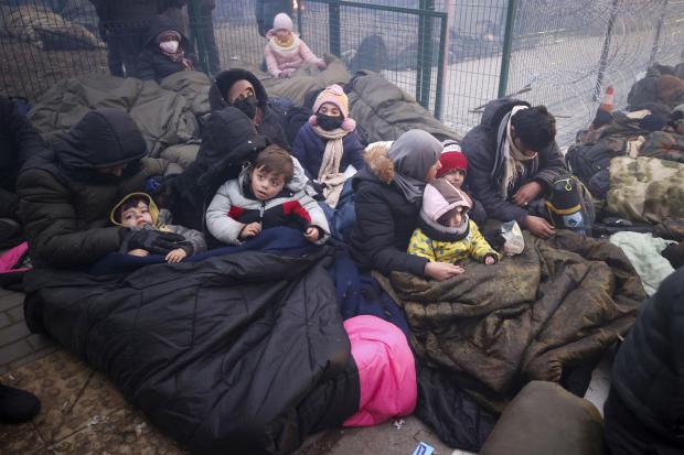 Migrants gather at the Belarus-Poland border. Photograph: AP