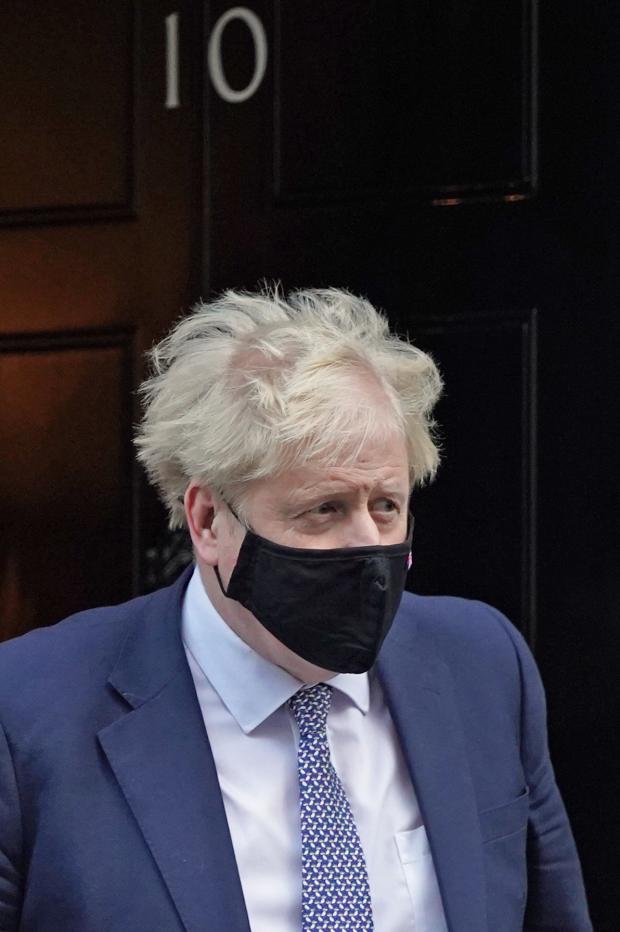 The National: Prime Minister Boris Johnson leaves 10 Downing Street, London, to attend Prime Minister's Questions at the Houses of Parliament. Picture date: Wednesday January 12, 2022. PA Photo. See PA story POLITICS PMQs. Photo credit should read: Stefan