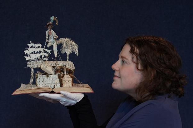 The National: Mystery book sculptures to be auctioned in Edinburgh.  The Scottish Book Trust commissioned the artist to make five new works for their first ever Scottish book week in 2012.  Each represented a classic of Scottish literature, Tam O'Shanter by Robert