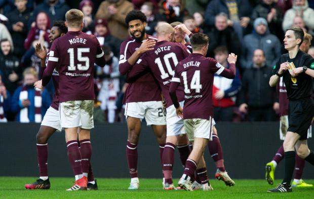 The National: Ellis Simms celebrates with his team-mates after scoring his first goal for Hearts