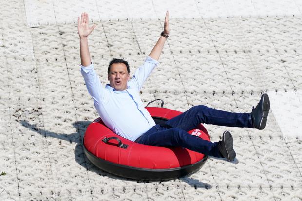 Scottish Labour leader Anas Sarwar has a go in a rubber ring during a visit to Newmilns Ski Centre in East Ayrshire. Photograph: PA