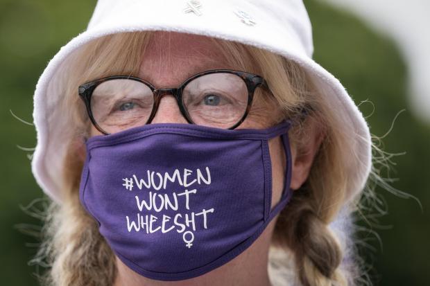 Members of the campaign group For Women Scotland demonstrate outside the Scottish Parliament in late 2021