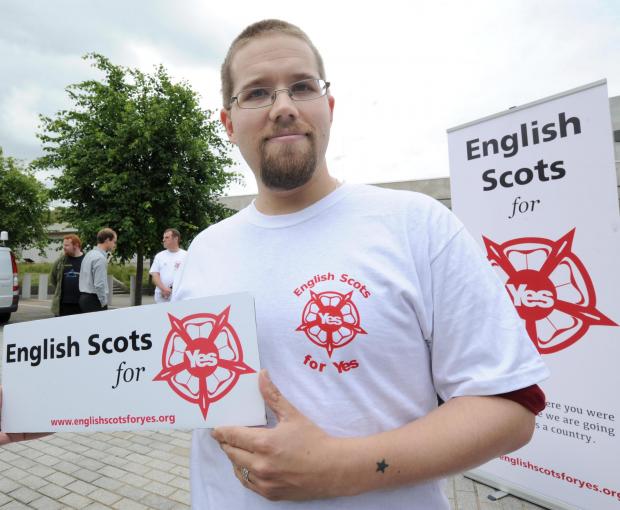 The National: Picture by Bill Fleming.Yes Scotland photocall for English Scots For Yes held outside the Scottish Parliament, Edinburgh..Pic shows Math Campbell-Sturgess (31) who is originally from Cambridge and has lived in Scotland for the past 13 years..