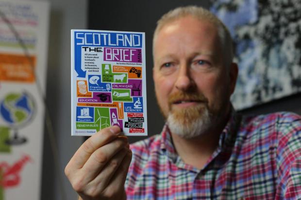 Believe in Scotland's Gordon MacIntyre-Kemp holds up a copy of Scotland the Brief