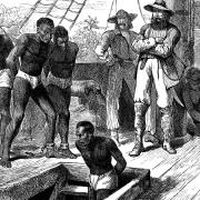 Captives being brought on board a slave ship on the West Coast of Africa (Slave Coast), c1880.