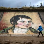 A mural of Robert Burns on the sea wall at Ardeer beach, near to his birthplace of Alloway in Ayrshire