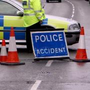 Police have closed the A85 in Perthshire after a car and motorcycle collision.