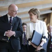 John Swinney and Nicola Sturgeon in the Scottish Parliament